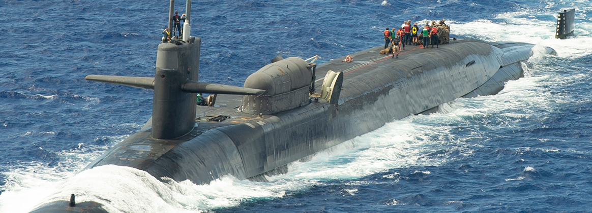 Marines assigned to the 1st Force Reconnaissance Company, III Marine Expeditionary Force, assemble a combat rubber raiding craft during a scheduled exercise aboard the guided-missile submarine USS Ohio (SSGN 726)